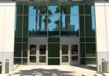 University of Massachusetts Global campus building entrance with glass facade