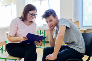 Woman school psychologist with teen