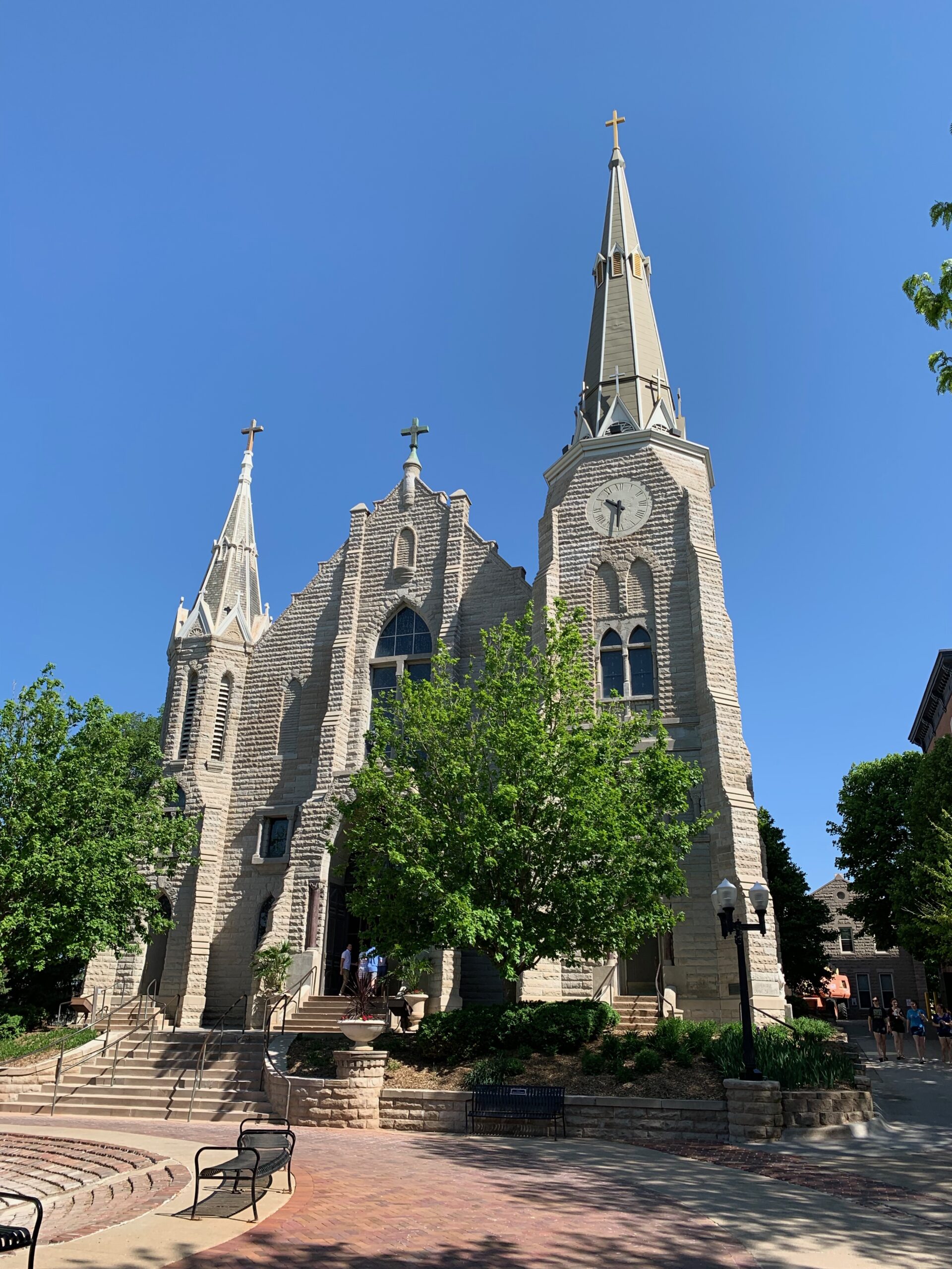 St. John's Church twin spires on Creighton University campus on a sunny day
