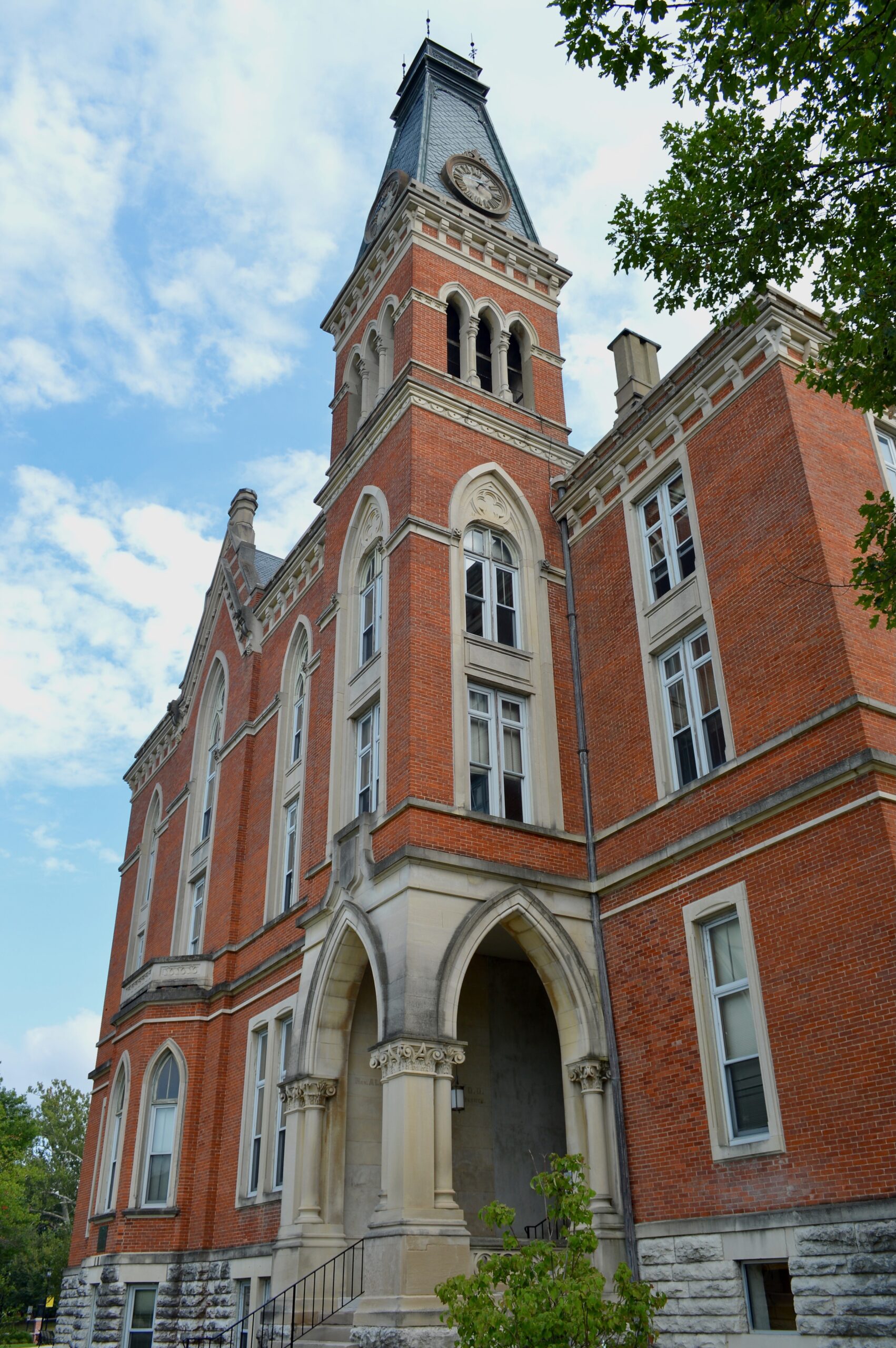 East College clock tower and Gothic arched entrance at DePauw University
